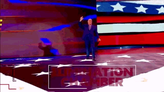 a man in a suit stands in front of an american flag and a sign that says ' nomination chamber ' on it
