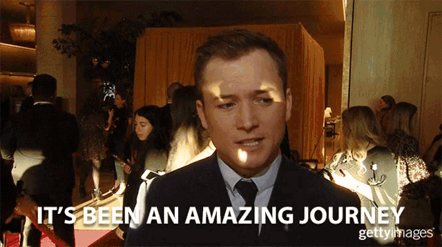 a man says it 's been an amazing journey in front of a crowd
