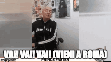 a bald man is sitting in a chair with the words vai vai vai vieni a roma on the bottom