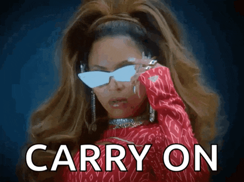 a woman wearing sunglasses says carry on