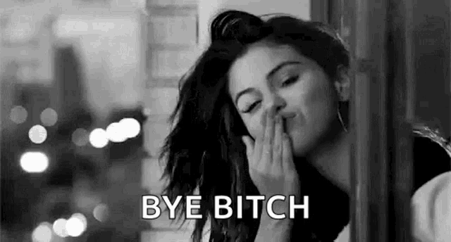 a woman is blowing a kiss and saying `` bye bitch '' .