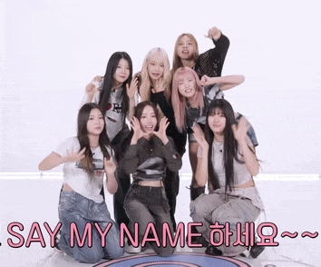 a group of girls are posing for a picture with the words say my name behind them