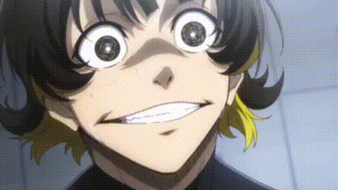 a close up of a person making a funny face with their mouth open and big eyes .