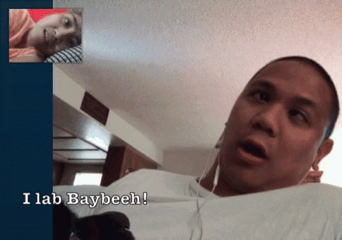 a man wearing ear buds says i lab baybeeh during a video call