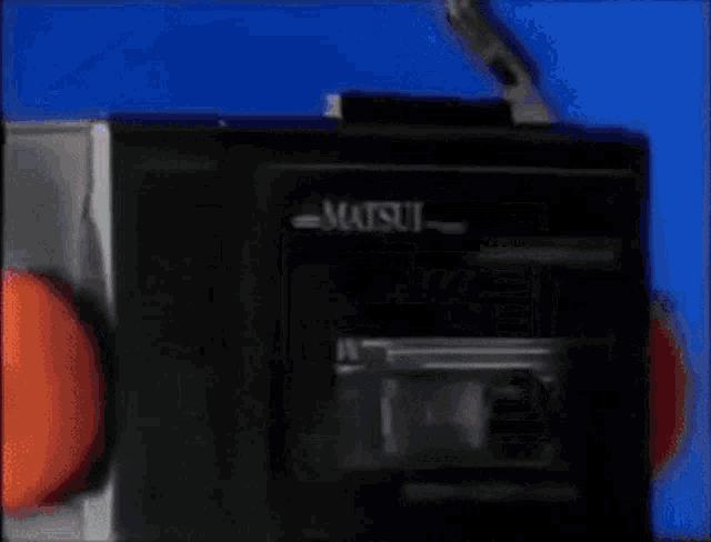 a matsui cassette player with headphones on it