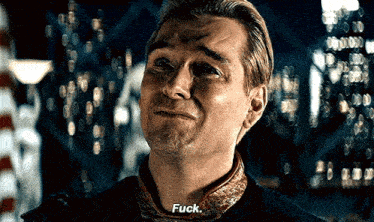 a close up of a man 's face with the word fuck on it .