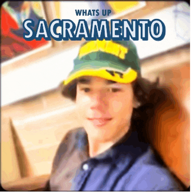 a man wearing a hat that says whats up sacramento on it