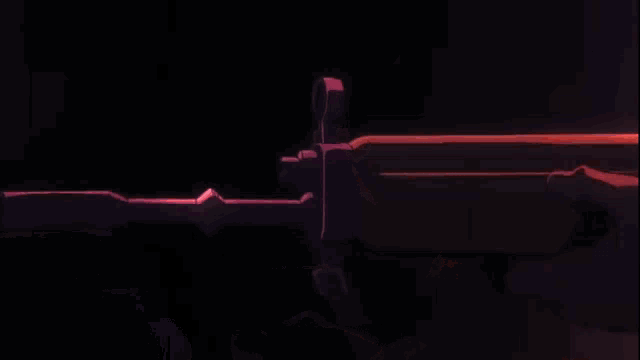 a man in a helmet is holding a gun in his hands