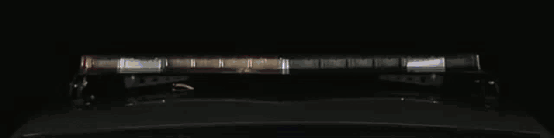a blue light is shining on a dark background