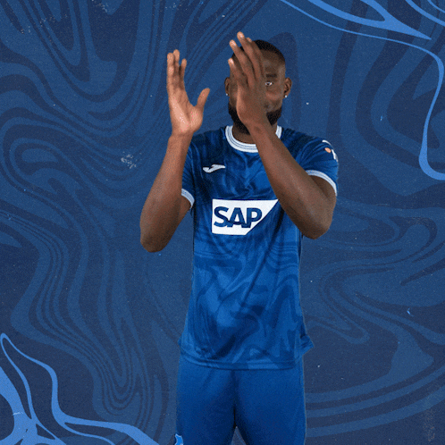 a man in a blue shirt that says sap on it