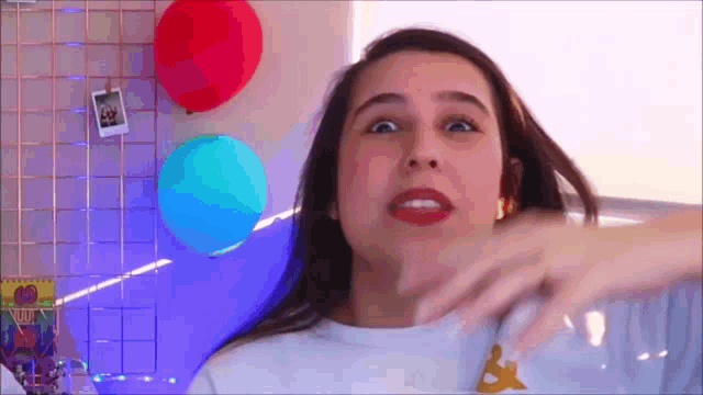a woman is making a funny face while wearing a kappa shirt