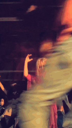 a blurry image of a person walking down a set of stairs