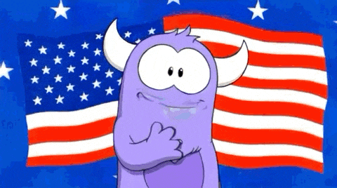a purple monster with horns stands in front of a large american flag