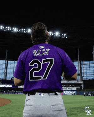 a baseball player wearing a purple jersey with the name beck on the back