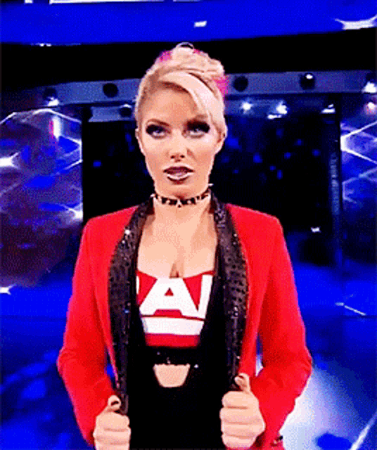 a woman in a red jacket with the letter a on her chest