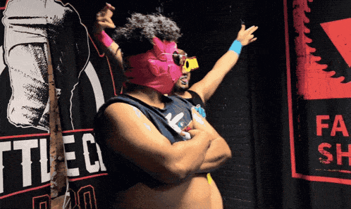 a man in a pink mask stands in front of a banner that says battlec