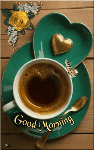 a cup of coffee on a saucer with the words good morning