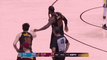 a basketball player with the number 2 on his jersey is celebrating