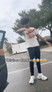 a man standing in front of a car with the words this is so kankan on the bottom right