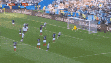 a soccer game is being played in a stadium with qatar airways advertising on the sidelines