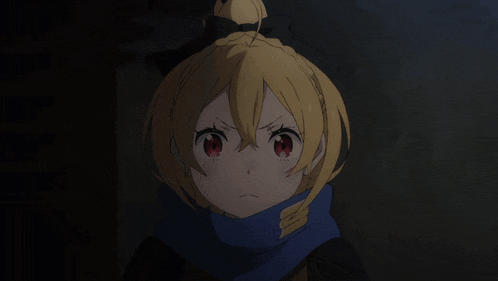 a girl with a scarf around her neck is pointing her finger