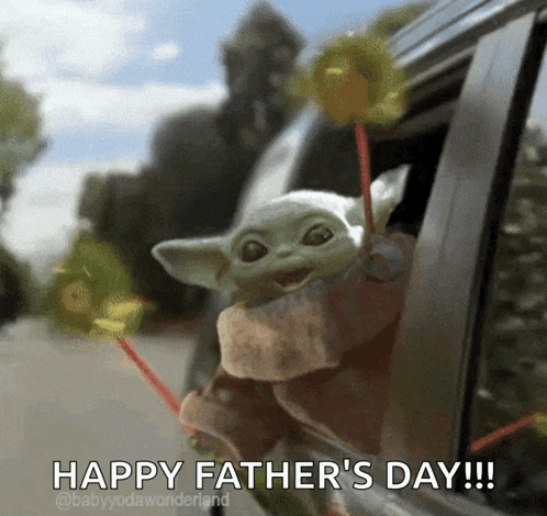 a baby yoda is sticking its head out of a car window and holding lollipops .