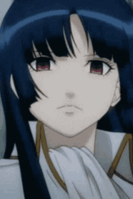 a close up of a girl 's face with blue hair