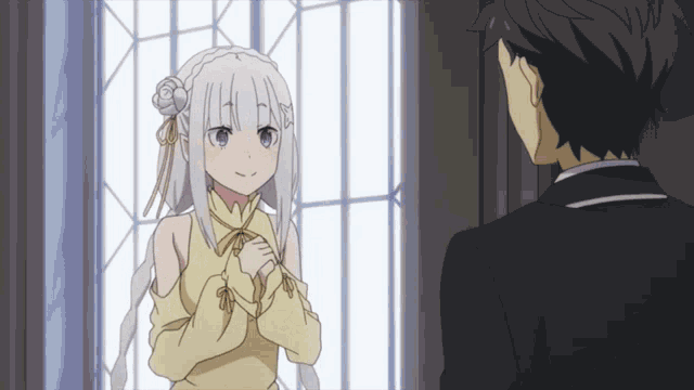 a boy and a girl are standing next to each other