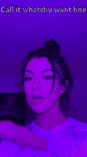a woman is standing in front of a purple background and says call it whatchu want hoe