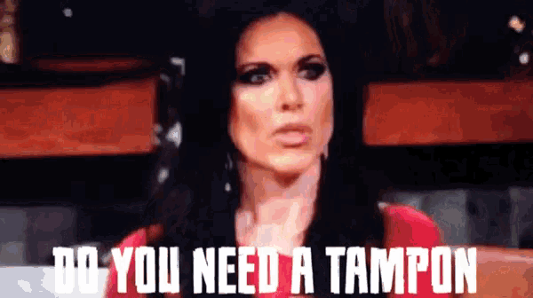 a woman in a red dress is asking if you need a tampon .