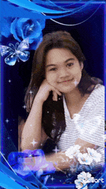 a girl in a blue frame with flowers and butterflies is smiling for the camera