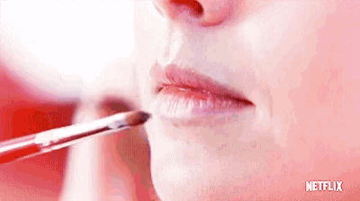 a close up of a woman 's lips with a netflix logo behind her