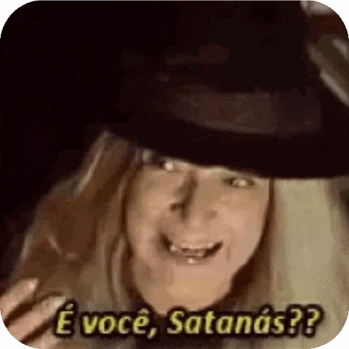 a witch wearing a black hat is smiling and saying e você , satanas ?