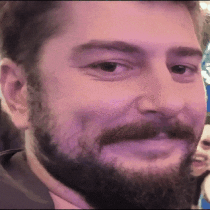 a close up of a man with a beard and mustache