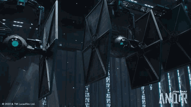 an advertisement for star wars andor with a picture of a tie fighter hanging from the ceiling