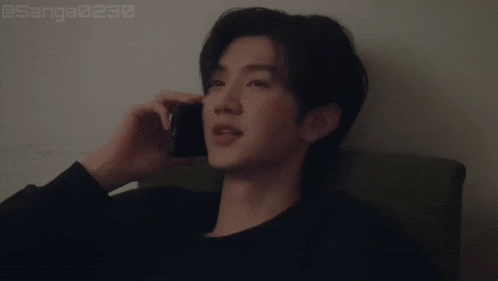 a man talking on a cell phone with the words good night written below him