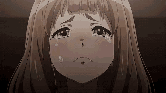a girl with brown hair is crying with tears running down her face