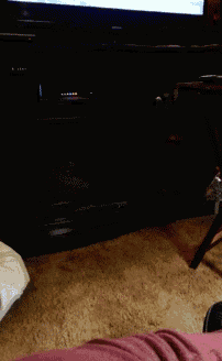a person is sitting in front of a tv with a balloon on it