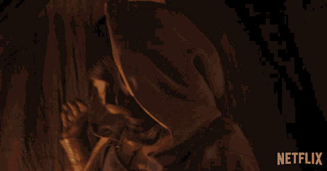a netflix ad shows a woman in a hooded coat