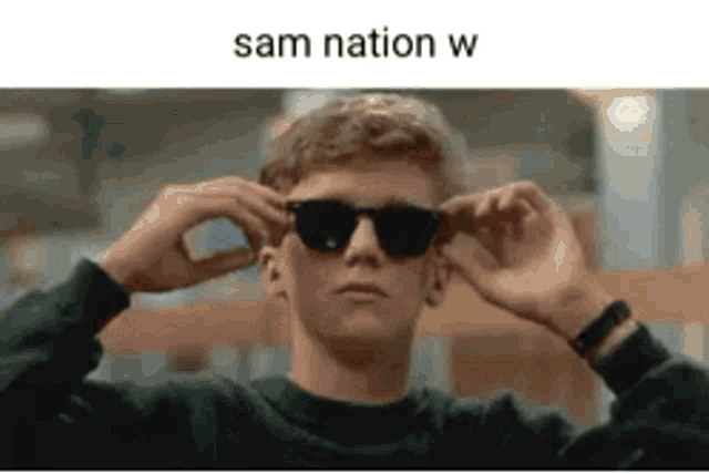 a man wearing sunglasses with the words sam nation w written on the bottom