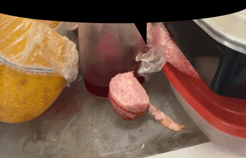 a glass container with a piece of food on it