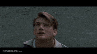 a group of people looking up at the sky with movieclips.com on the bottom