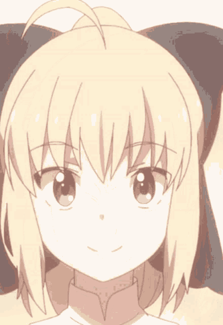 a girl with blonde hair and green eyes is smiling