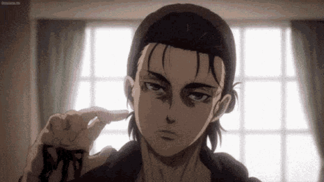 eren jaeger from attack on titan is holding a piece of paper in his hand and pointing at it .