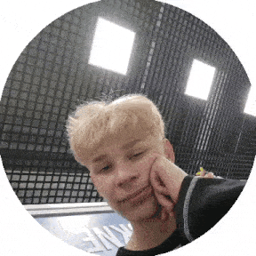 a young man is taking a selfie with his hand on his face
