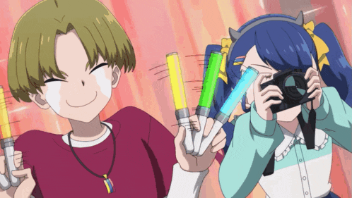 a girl is taking a picture with a camera while a boy is smiling