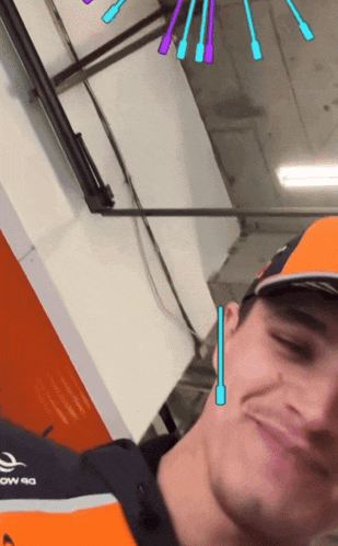 a man wearing an orange shirt that says ow 40
