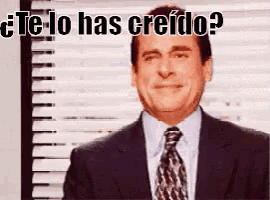 a man in a suit and tie is smiling with the words te lo has creido written above him