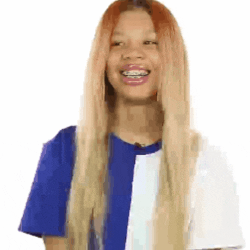 a woman with braces on her teeth is wearing a blue and white striped shirt .