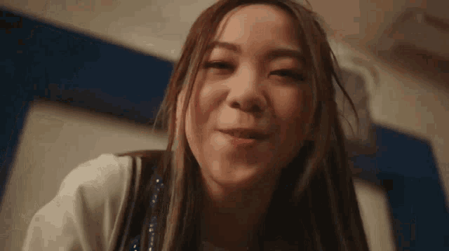 a close up of a woman making a funny face